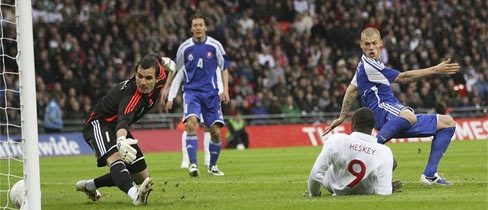 Emile Heskey turns home the opening goal against Slovakia.
